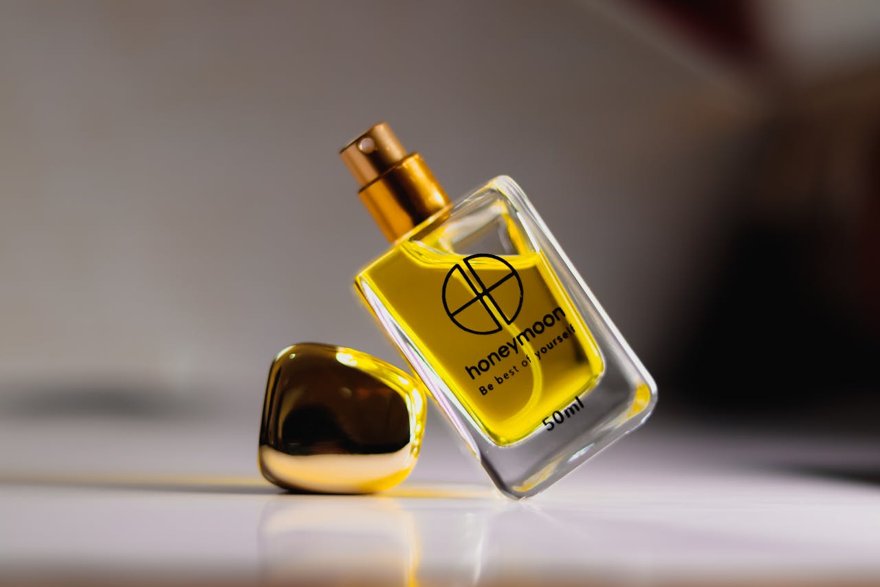 Mastering the First Impression: Your intriguing post title goes here A luxurious perfume bottle with golden liquid, exuding elegance and sophistication in every detail.