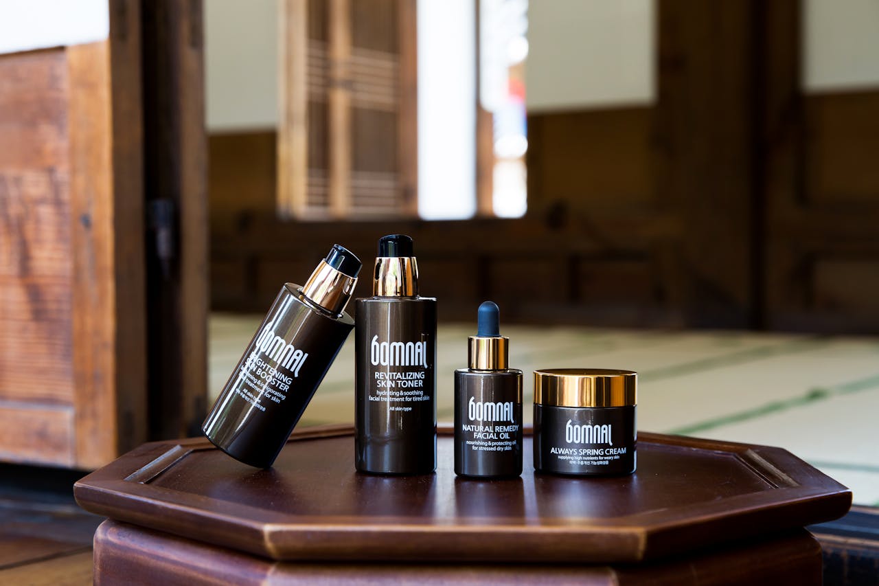 services-03 Skincare products elegantly displayed on a wooden surface with a serene indoor background.